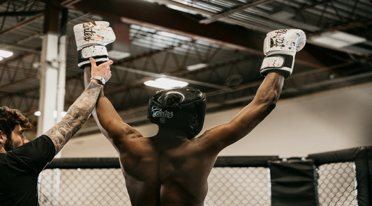 boxer celebrates after using boxing glove deodoriser spray