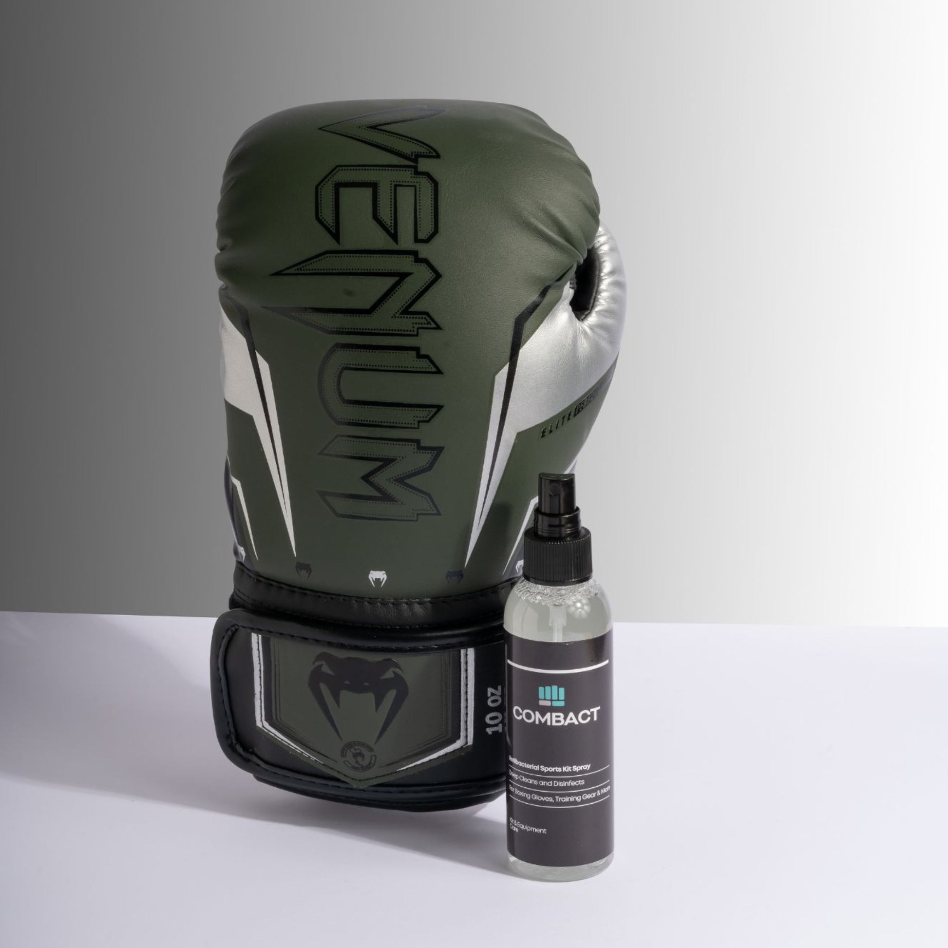 Professional Image of a boxing glove next to Combact Antibacterial Sports Kit Spray. Used for as a Boxing Gloves Cleaner Spray