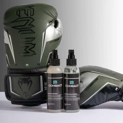 Photograph of a pair of boxing gloves next to Combact Sportswear Refresher and Antibacterial Sports Kit Spray. 