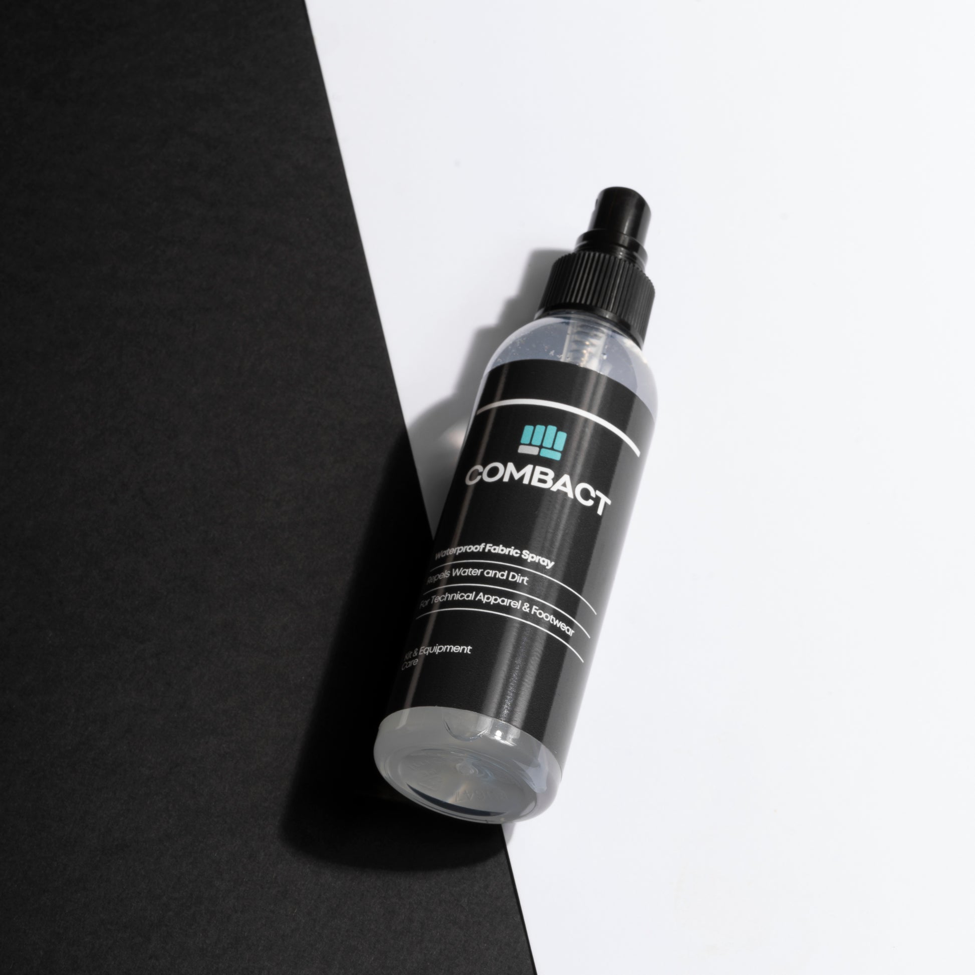 Professional photograph of Combact Waterproof Fabric Spray. Used to protect sports kit. Waterproof spray for running jacket. Waterproofing spray for running clothes. 